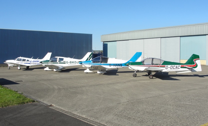 The Cotswold Aero Club fleet lined up on the flight line at Gloucestershire Airport