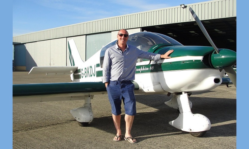 A Cotswold Aero Club member beside one of the club's Robin aircraft